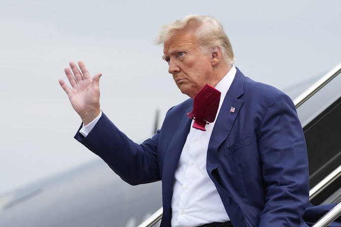 Former President Donald Trump waves as he steps off his plane at Ronald Reagan Washington National Airport, Thursday, Aug. 3, 2023, in Arlington, Va., as he heads to Washington to face a judge on federal conspiracy charges alleging Trump conspired to subvert the 2020 election. (AP)