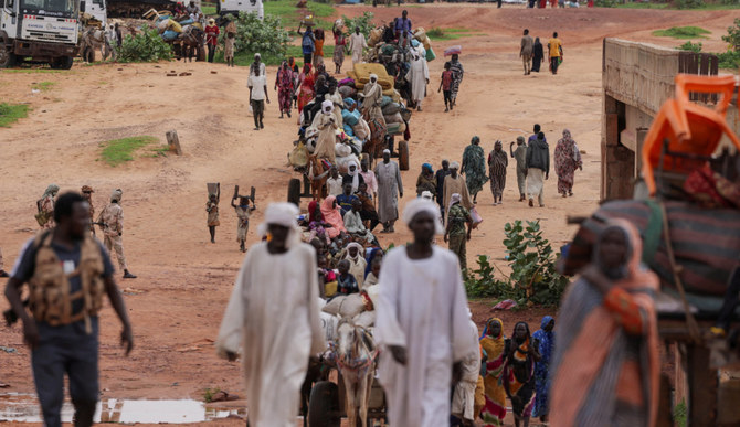 Sudanese people, who fled the conflict in Murnei in Sudan's Darfur region, cross into Adre, Chad, on August 2, 2023.(REUTERS/Zohra Bensemra)