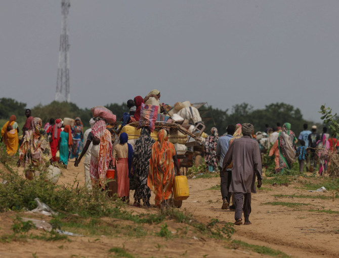 Sudanese people, who fled the conflict in Murnei in Sudan's Darfur region, cross into Adre, Chad, on August 2, 2023.(REUTERS/Zohra Bensemra)
