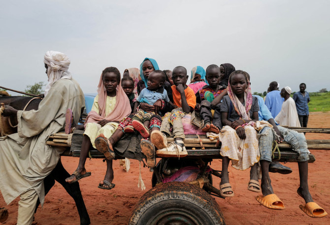 Sudanese people, who fled the conflict in Murnei in Sudan's Darfur region, cross into Adre, Chad, on August 2, 2023.(REUTERS/Zohra Bensemra)