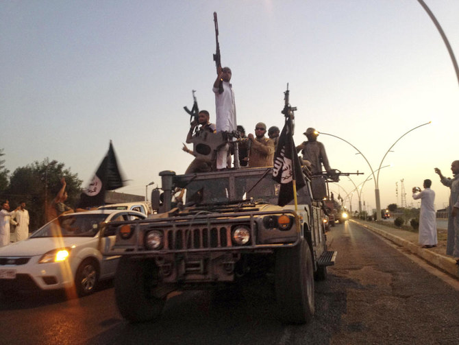 Fighters from the Daesh group parade in a commandeered Iraqi security forces armored vehicle in the northern city of Mosul, Iraq, June 23, 2014. The Daesh group announced Thursday the death of its little known leader Abu Al-Hussein Al-Husseini Al-Qurayshi who had been heading the extremist organization since November. (AP Photo, File)