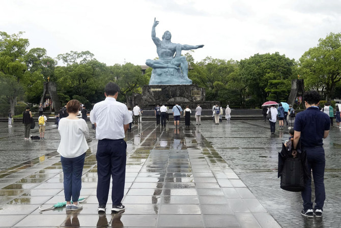 People offer silent prayers for the victims of the 1945 atomic bombing to mark the 78th anniversary of the bombing, following a change in venue and scaling down of the ceremony due to Typhoon Khanun approaching. (File/Reuters)