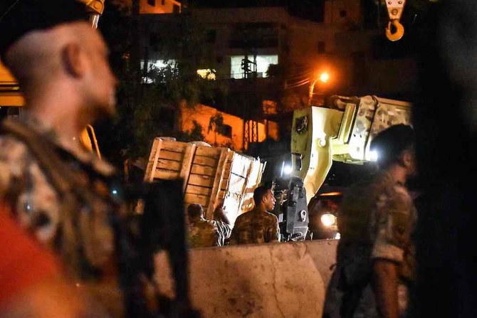 Lebanese army soldiers unload boxes from a truck in the town of Kahale, where two people were killed in clashes between members of the Iran-backed Hezbollah group and residents of the Christian town on Aug. 9, 2023. (AFP)