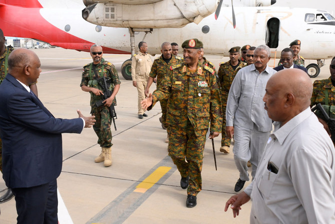 Sudan's Army chief Abdel Fattah al-Burhan (C) arrives to the coastal city of Port Sudan on August 27, 2023, in his his first public foray in months (AFP)