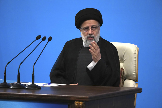 Iranian President Ebrahim Raisi arrives at his press conference in Tehran, Iran. (AP)