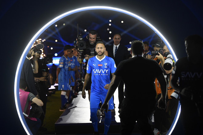 New signing Al-Hilal's Neymar is presented to the fans inside the stadium before the match. (AP)