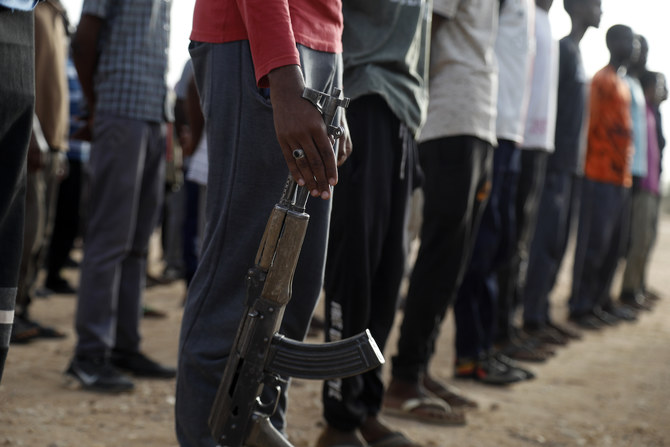 Civilians recruited by the Sudanese army take part in military training in the Kassinger area of Sudan’s Northern State. (File/AFP)