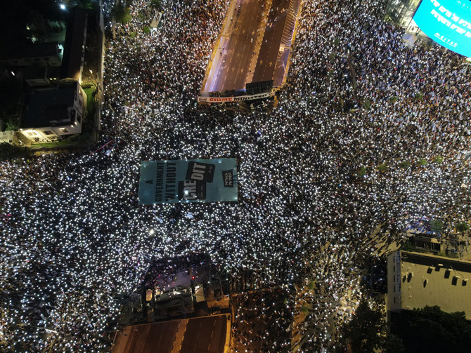 Thousands of protesters march on July 29, 2023, in Tel Aviv against the Israeli government's judicial overhaul plan. (AFP)