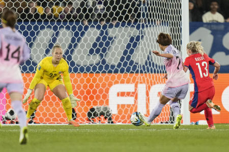 Japan's Hinata Miyazawa scores her side's third goal against Norway's goalkeeper Aurora Mikalsen during the Women's World Cup match in Wellington, New Zealand, Saturday, Aug. 5, 2023. (AP)
