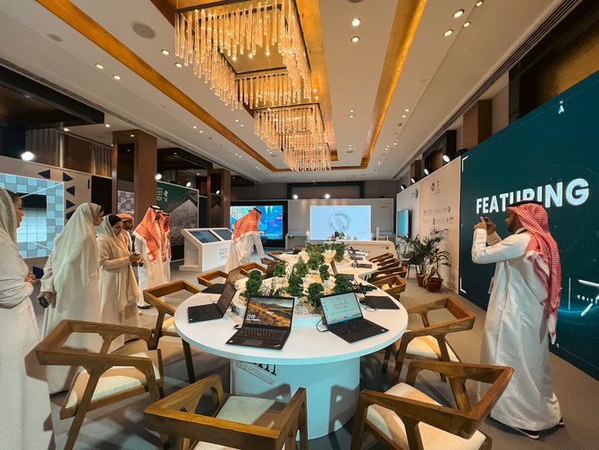 Visitors attend the Media Oasis exhibition organized by the Saudi Ministry of Media on the sidelines of the G20 Summit in New Delhi on Sept. 9, 2023. (AN photo/Rahaf Jambi)