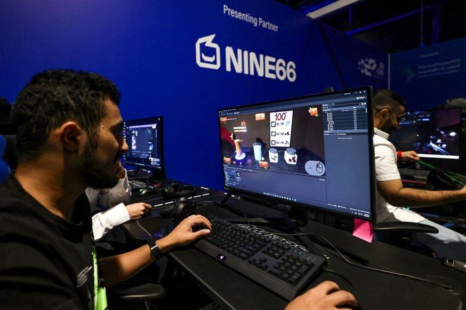 Above, Saudi trainees attend a training course at the Saudi Esport Academy in Riyadh on August 29, 2023. (AFP)