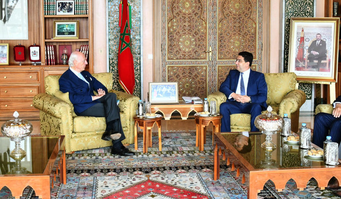 A handout released by the Moroccan Ministry of foreign affairs on July 5, 2022, shows Morocco's Foreign Minister Nasser Bourita (R) receiving the UN Secretary General's Personal Envoy for Western Sahara, Staffan de Mistura (L) in the capital Rabat. (AFP)