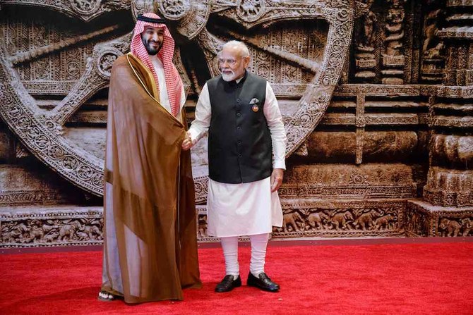 Saudi Arabia’s Crown Prince and prime minister Mohammed bin Salman is welcomed by Indian prime minister Narendra Modi ahead of the G20 Leaderss Summit in New Delhi on Sept. 9, 2023. (AFP)