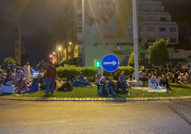 People gather on a street in Casablanca early Saturday following a powerful earthquake in Morocco. (REUTERS)