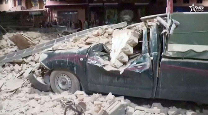 Above, a damaged car and debris from the earthquake in Marrakech, Morocco, on September 9, 2023. (Al Oula TV/Handout via Reuters)