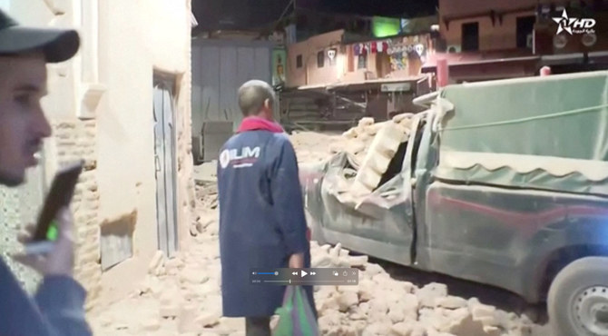 People inspect the damage from the earthquake in Marrakech, Morocco, on September 9, 2023. (Al Oula TV/Handout via REUTERS)