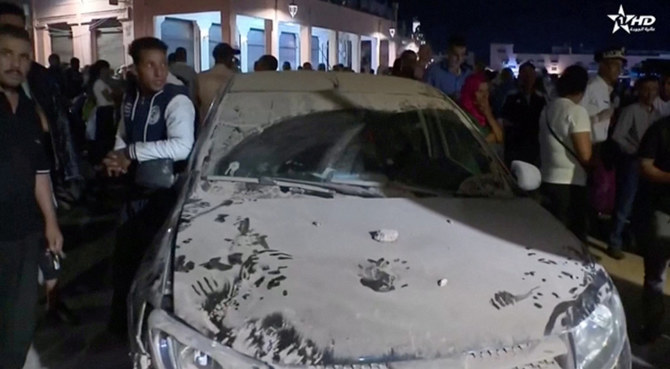 A car is covered in dust in the aftermath of the earthquake in Marrakech, Morocco, on September 9, 2023. (Al Oula TV/Handout via REUTERS)