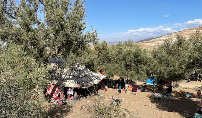 Families take shelter under a tent in Tafeghaghte, a remote village of the High Atlas mountains, following a powerful earthquake in Morocco, September 10, 2023. (REUTERS)