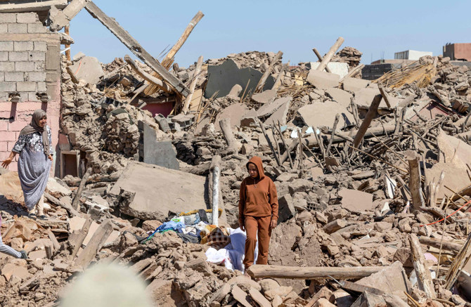 Villagers inspect the rubble of collapsed houses in Tafeghaghte, 60 kilometres (37 miles) southwest of Marrakesh, on September 10, 2023, two days after a devastating 6.8-magnitude earthquake struck the country. (AFP)