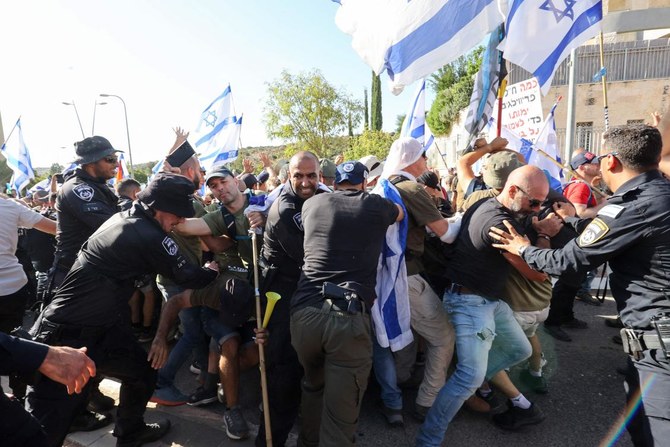 Israeli police disperse protesters as they block the entrance to the residence of Justice Minister Yariv Levin, in the central city of Modiin on September 11, 2023, as they protest against the government’s controversial judicial reform bill. (AFP)