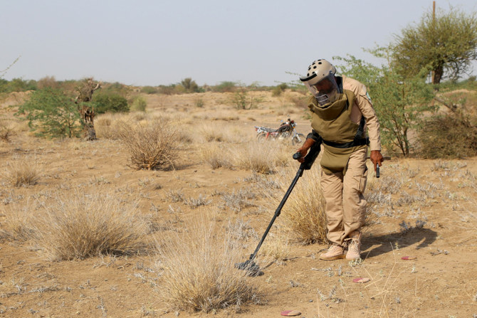 A member of Yemen's government forces searches for explosive devices in the village of Hays in Yemen's western province of Hodeida on August 11, 2023. (AFP)