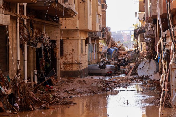 Overturned cars lay among other debris caused by flash floods in Derna, eastern Libya, on September 11, 2023. (AFP)