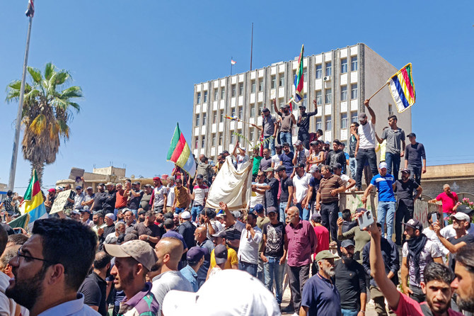 People protest in the Syria's southern city of Sweida on September 1, 2023. (Suwayda24 via AFP)