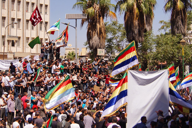 People protest in the Syria's southern city of Sweida on September 1, 2023. (AFP)