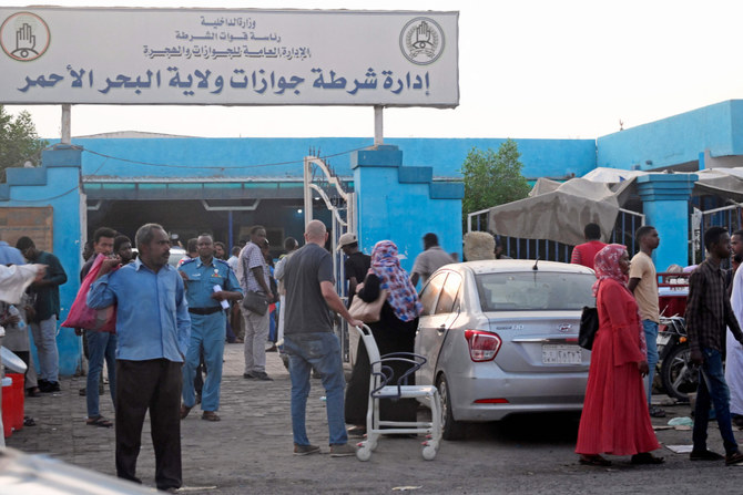 Sudanese wait outside a Passports and Immigration Services office in Port Sudan on September 3, 2023, following an announcement by the authorities of the resumption of issuing travel documents in war-torn Sudan. (AFP)
