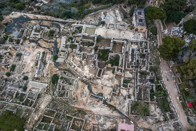 This aerial view shows water flowing through the ruins at the site of the ancient Greco-Roman city of Cyrene (Shahhat). west of Derna, on Sept. 21,2023, in the aftermath of a devastating flood. (AFP)