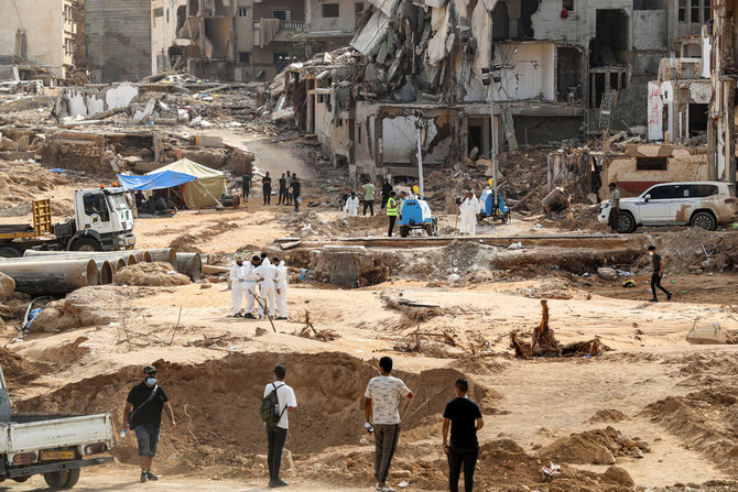 The enormous flood, fuelled by torrential rains on September 10, had broken through two upstream dams and sent a giant wave crashing down the previously dry river bed, or wadi, that bisects the city of about 100,000 people.(AFP)