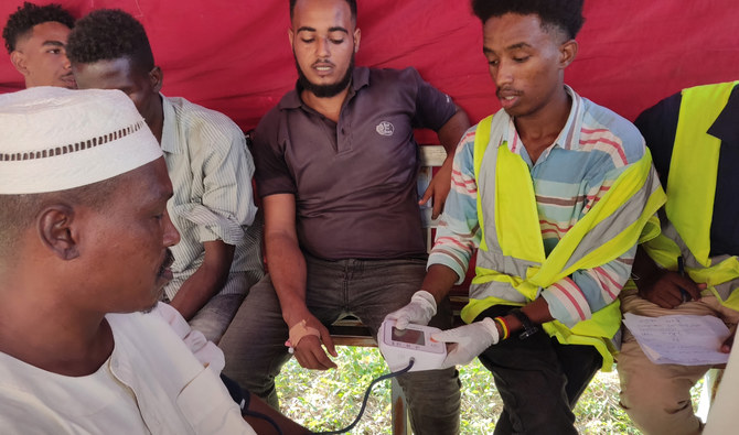 People queue at a medical laboratory to get tested for Dengue fever in the eastern Gedaref state of War-torn Sudan on September 22, 2023, amid reports of the spread of the viral infection. (AFP)