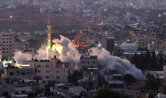 Smoke billows as Israeli soldiers demolish a house at the Asker camp for Palestinian refugees east of Nablus city in the occupied West Bank, early on August 8, 2023. (AFP/File)