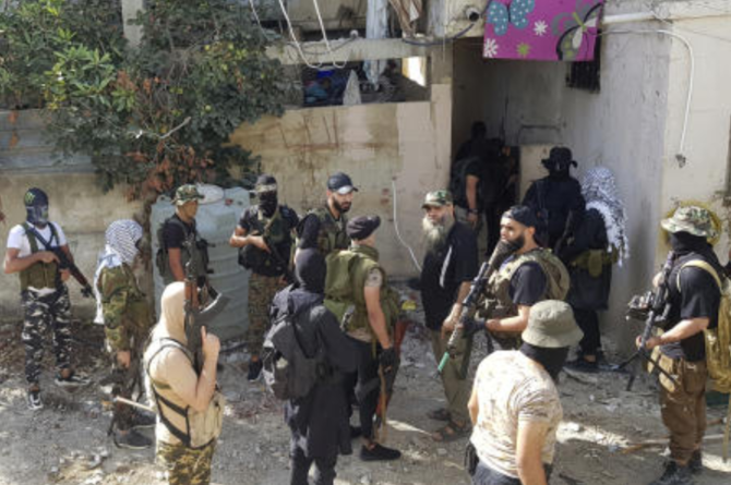 Members of Islamic militant factions gather in the Palestinian refugee camp of Ein el-Hilweh near the southern port city of Sidon, Lebanon, on Sept. 29, 2023. (AP)