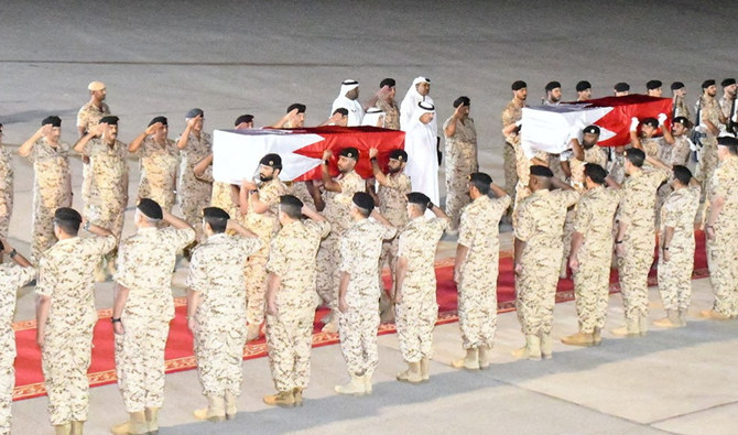 A screen grab from a video shows the arrival of the bodies of two Bahrain Defence Force officers, who were killed in a Houthi drone attack. (Bahrain News Agency)
