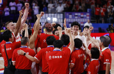 Japanese players celebrate after winning the match. (Reuters)