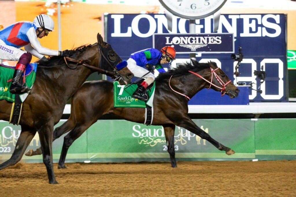 A general view of jockeys and horses competing in the Longines Red Sea Turf Handicap during the Saudi Cup 2023 at King Abdulaziz Racecourse on February 25, 2023 in Riyadh, Saudi Arabia. (Photo by Francois Nel/Getty Images) 