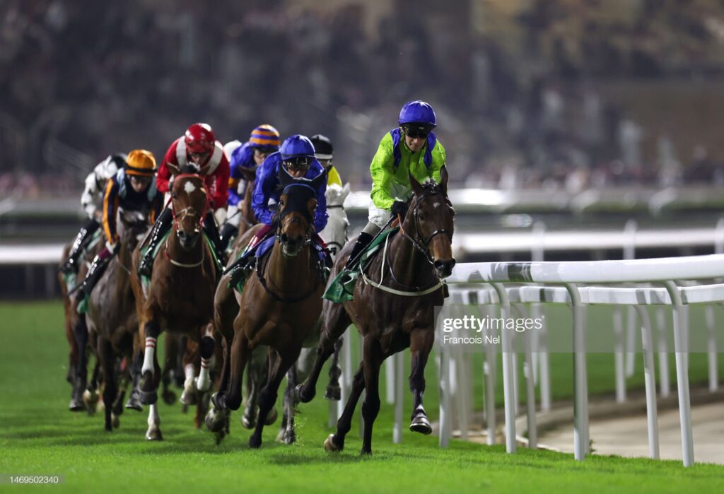 A general view of jockeys and horses competing in the Longines Red Sea Turf Handicap during the Saudi Cup 2023 at King Abdulaziz Racecourse on February 25, 2023 in Riyadh, Saudi Arabia. (Photo by Francois Nel/Getty Images) 