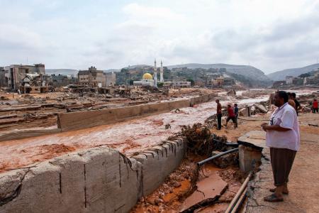 People look at the damage caused by freak floods in Derna, eastern Libya, on September 11, 2023. (AFP)