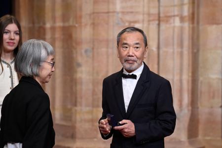 Japanese writer Haruki Murakami looks on after receiving a medal ahead of the 2023 Princess of Asturias award ceremony at the Campoamor theatre in Oviedo on October 20, 2023. (AFP)