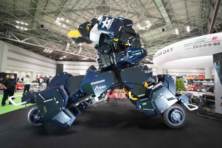 Japanese robotics startup Tsubame Industries exhibit the ARCHAX robot, weighing 3.5 tonnes and measuring 4.5 meters in height, during the press day of the Japan Mobility Show in Tokyo on October 25, 2023. (AFP)