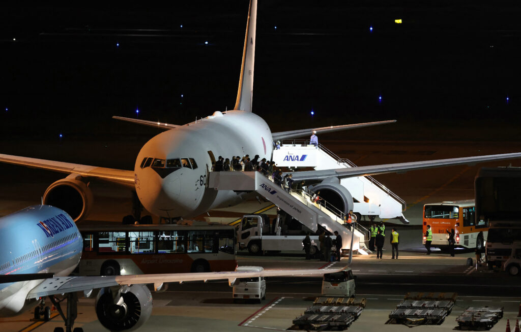 Sixty Japanese nationals and family members with foreign nationality returned to Japan from Israel. (AFP)