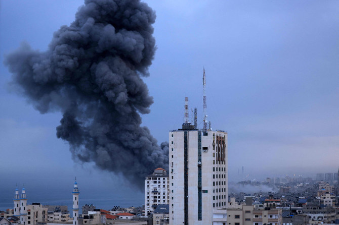 Smoke rise above buildings during an Israeli air strike, in Gaza City on October 9, 2023. (AFP)