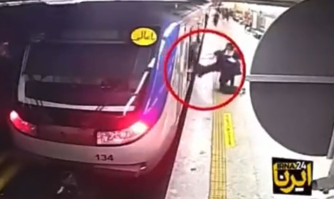 A screenshot of a purported video showing the incident, in which a rights group claims Armita Garawand, had been badly injured in a run-in on the Tehran metro with female morality police officers. (X/@sayajm85)