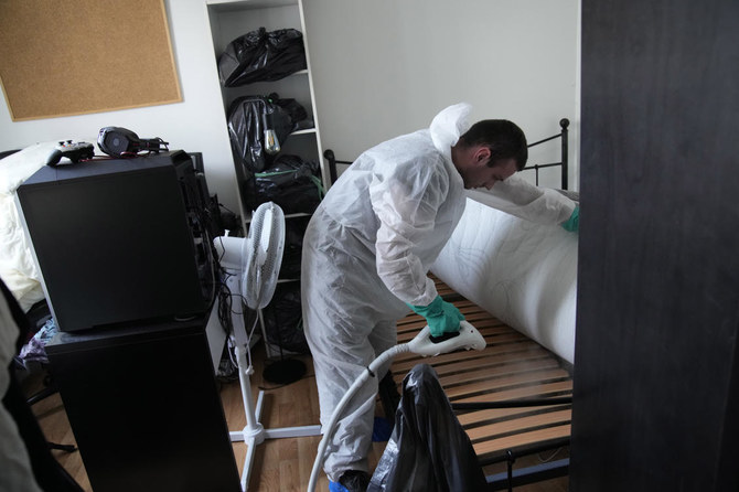 Pest control technician Lucas Pradalier sprays steam on a bed in a Paris apartment, Wednesday, Oct. 4, 2023. The French government has been forced to step in to calm a nation increasingly anxious about bedbugs. (AP)