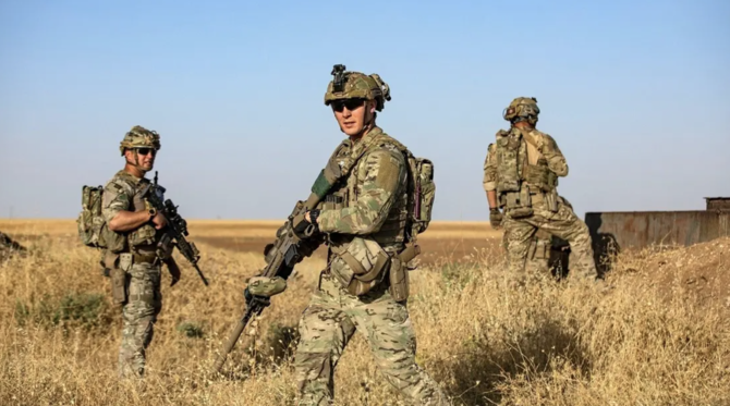 US troops patrol near an oil field in al-Qahtaniyah in Syria's northeastern Hasakah province, close to the border with Turkey, on June 14, 2023. (AFP/File Photo)