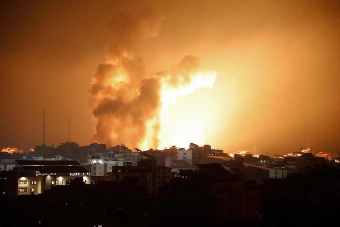 Above, fire and smoke rise above buildings during an Israeli air strike in Gaza City on Oct. 8, 2023. (AFP)