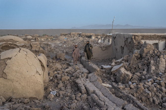 Taliban fighters guard at the site of an earthquake in Zenda Jan district in Herat province, of western Afghanistan, Sunday, Oct. 8, 2023. (AP)