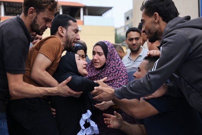 At least nine Americans could be among over 1,000 casualties from the fighting between Israeli forces and Hamas militants. Above, Palestinians mourn the death of their relatives following an Israeli air strike on the refugee camp of Jabalia in the Gaza Strip on Oct. 9, 2023. (AFP)