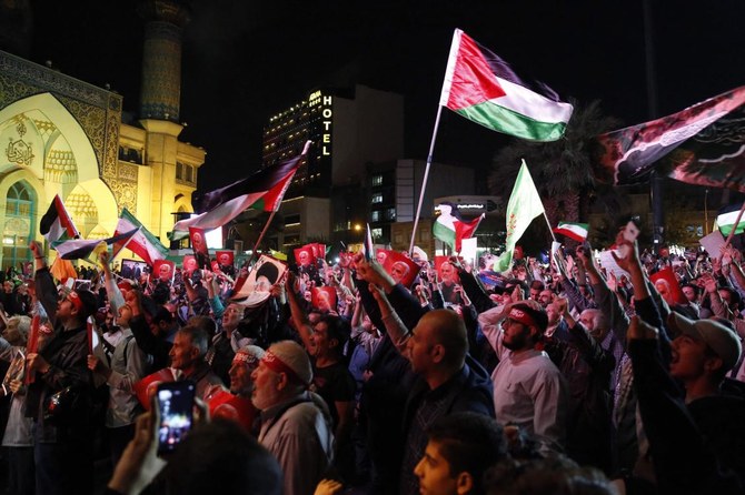 Iranians attend a gathering in Tehran on October 7, 2023, to express their solidarity with Palestine after Hamas militants launched a deadly air, land and sea assault into Israel from the Gaza Strip. (AFP)